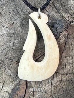 Old New Zealand Carved Fish Hook Pendant on Black Cord. Beautiful collection and